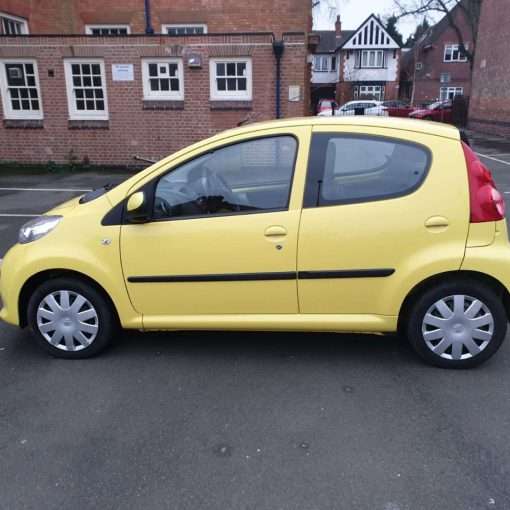 For Sale: Yellow Peugeot 107 - side view