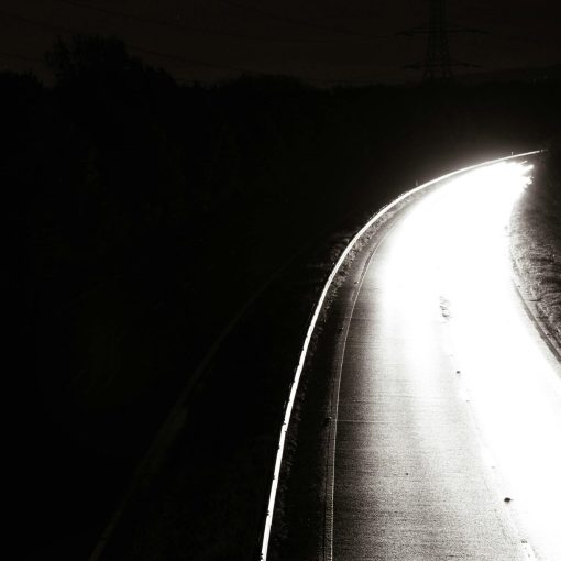 Driving in the dark - image of a road at night
